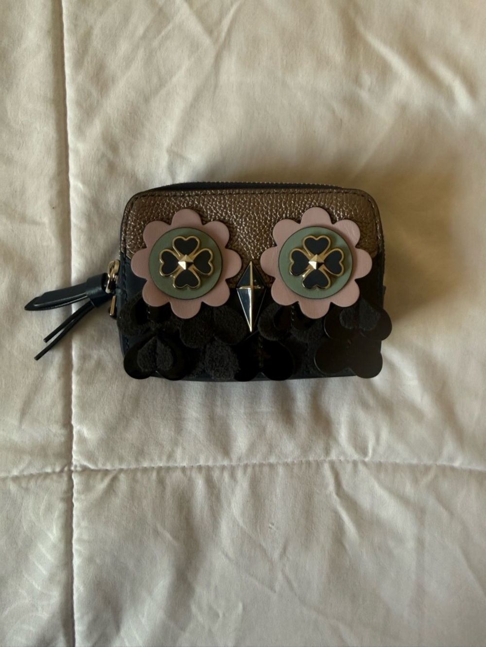 kate spade metallic bronze and black floral appliqué wristlet